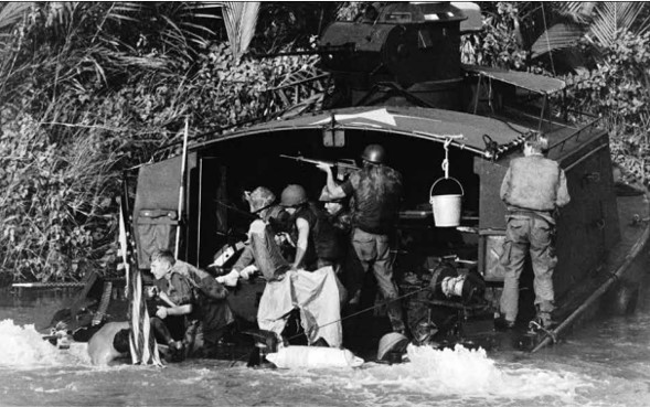 Riverine Assault Force &#40;Task Force 117&#41; Sailors trade fire with Viet Cong ambushers after the Americ