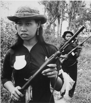 Girl volunteers of the People&#39;s Self-Defense Force of Kien Dien, a hamlet of Ben Cat district 50 kil