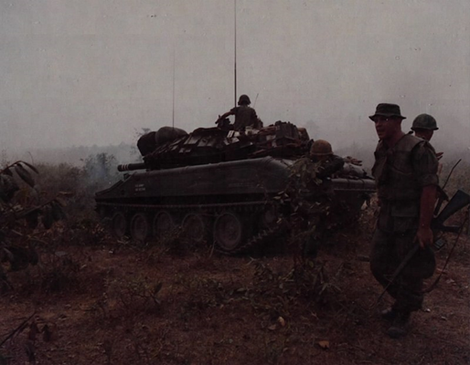 ATTACK ON LONG BINH POST. Members of the 1st Squadron 11th Armored Cavalry Regiment, surround their 