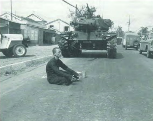 Buddhist Monk Blocks the Path of a Tank