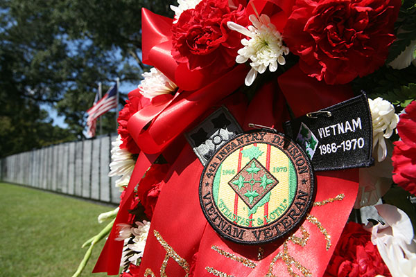 A wreath rests at the Vietnam Traveling Memorial Wall at Georgia Southwestern State University in re