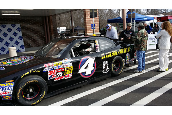 Earnhardt signs his autograph for fans at the Sam&#39;s Club grand opening in Mooresville, N.C.