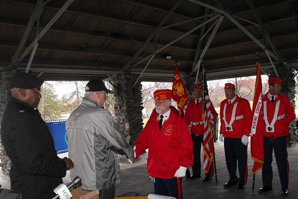 Chairman Steve Petak presenting Vietnam Veteran Lapel Pin to a Marine Corps League member.