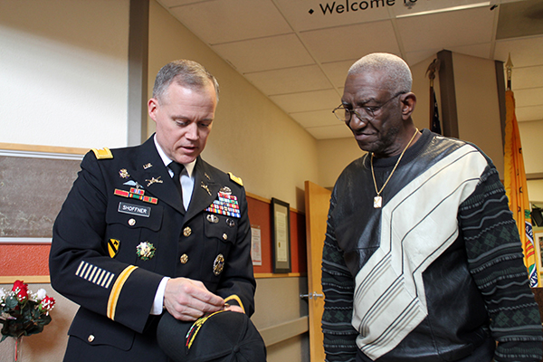 Col. Andrew Shoffner presents the Vietnam Veteran Lapel Pin