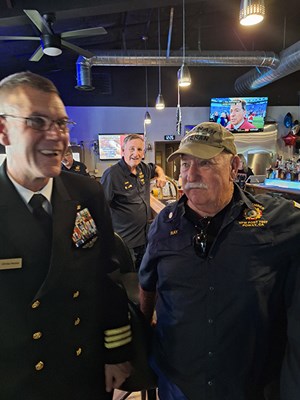 VWC Chief, Public Engagement, Cmdr. Brian Wierzbicki, USN, stands beside the Vietnam veteran he