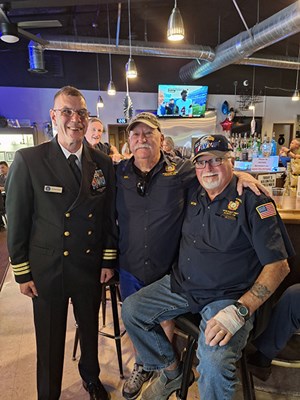 VWC Chief, Public Engagement, Cmdr. Brian Wierzbicki, USN, stands next to the Vietnam veterans 