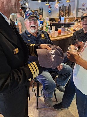 VWC Chief, Public Engagement, Cmdr. Brian Wierzbicki, USN, laughs with some of the Vietnam vete