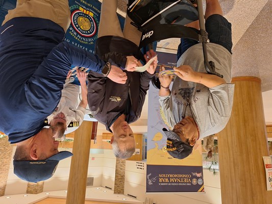 VWC staff pictured with a Vietnam veteran.