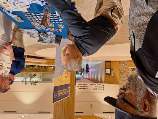 VWC staff speak with Vietnam veterans at the VWC display table.