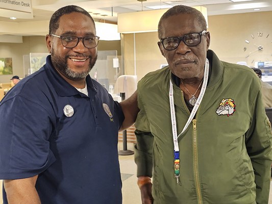 A Vietnam veteran receives a VVLP from a VWC staff member.