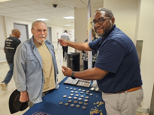 The Vietnam veteran is presented with a VVLP.