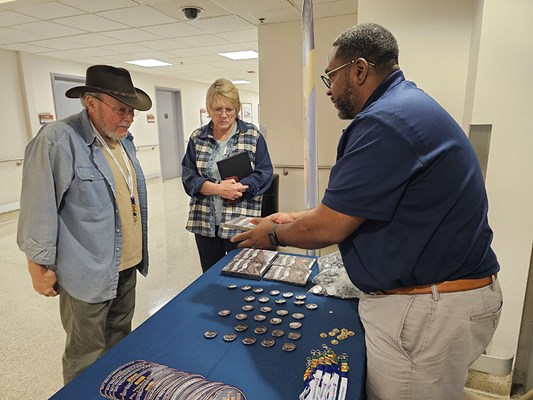 A Vietnam veteran and his wife speak with a VWC staff member.