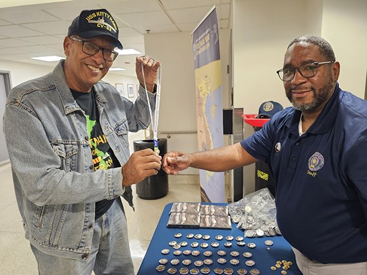 A Vietnam veteran receives a VVLP from a VWC staff member.