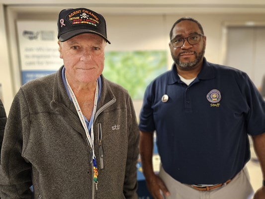 A Vietnam veteran receives a VVLP from a VWC staff member.
