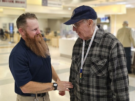 A Vietnam veteran receives a VVLP from a VWC staff member.