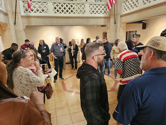 Attendees mingle during the event.