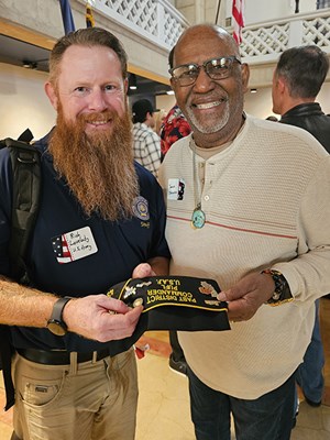A Vietnam veteran smiles after receiving a VVLP.
