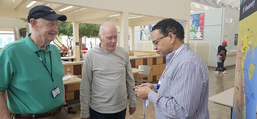 Ben Bryant pins two Vietnam veterans at the VA Medical Center in Richmond..