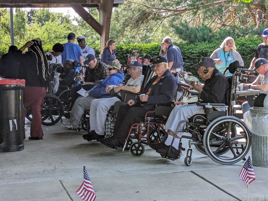 Veterans enjoy an outdoor cookout.