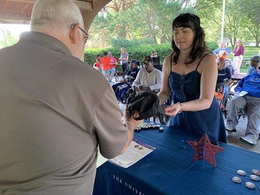 Jamie Hammon of the VWC shares information with veterans.