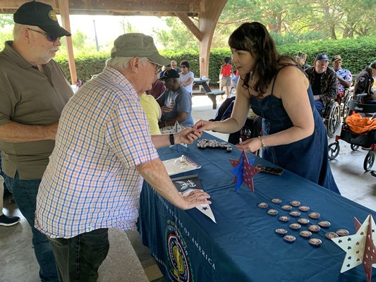 Jamie Hammon of the VWC shares information with veterans.
