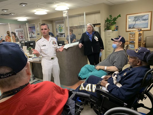Rear Adm. Douglas G. Perry speaks to veterans