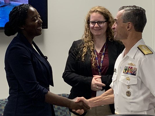 Rear Adm. Douglas G. Perry speaks with hospital and VA administrators