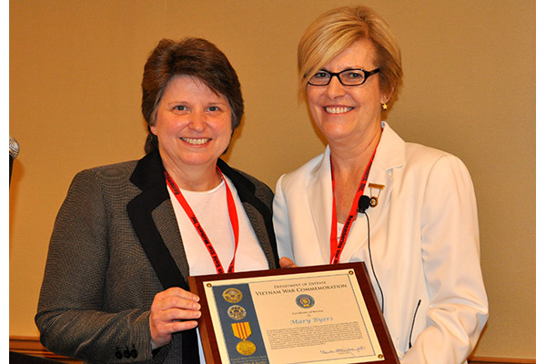 Former President Mary Byers of Nashville, Tenn. receives a Certificate of Service presented by Yvonn