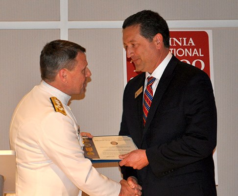 Adm.Gortney, Commander, U.S. Fleet Forces presents Virginia International Tattoo with partner flag.