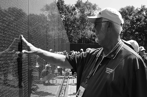 Vietnam veteran touches the names of his comrades.