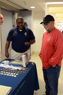 A Vietnam veteran speaks with a VWC staff member. 