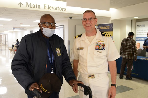 A Vietnam veteran is presented with a VVLP from Cmdr Brian Wierzbick