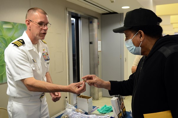 VWC's Cmdr Brian Wierzbicki speaks with a Vietnam veteran.