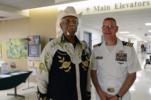 A Vietnam veteran receives a VVLP from Cmdr. Brian Wierzbicki.