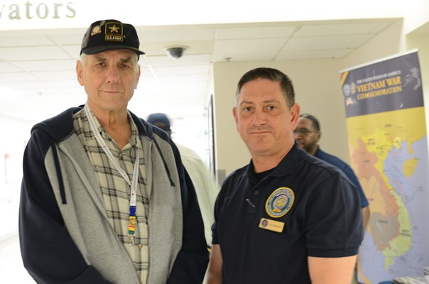 A Vietnam veteran is presented with a VVLP from a VWC staff member. 