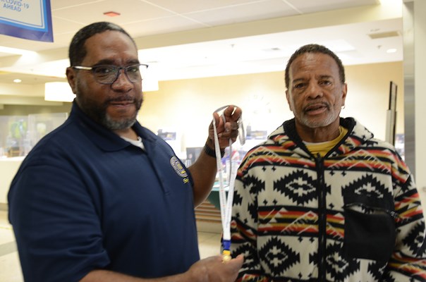 A Vietnam veteran is presented with a VVLP from a VWC staff member. 