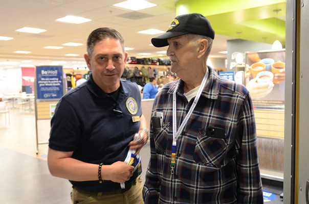 A Vietnam veteran is presented with a VVLP from a VWC staff member. 