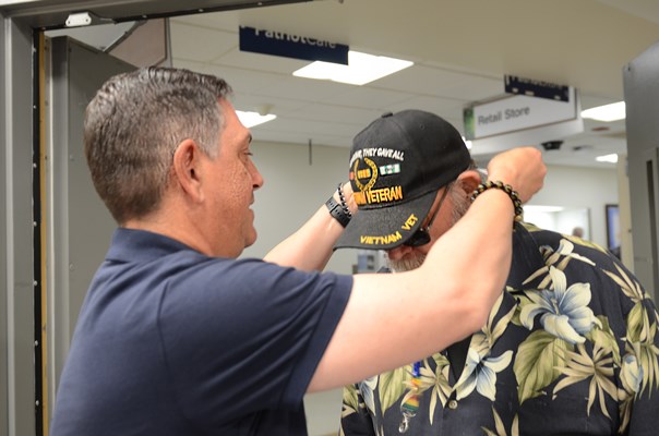 A VWC staff member presents a VVLP to a Vietnam veteran.