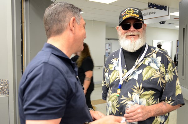 A Vietnam veteran is presented with a VVLP from a VWC staff member. 