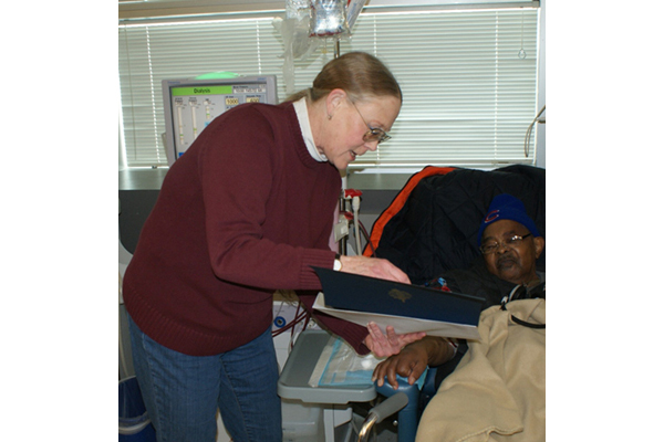 Earl Washington receiving DAR certificate and Vietnam Veteran Lapel Pin.