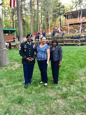 Flag-raising in honor of fallen heroes in a outdoor amphitheater in the Menominee Nation.