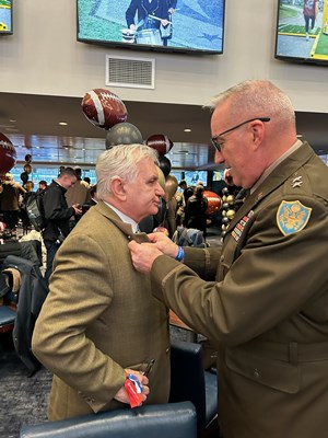 U.S. Army Maj. Gen. Ed Chrystal, Jr., presents U.S. Senator Jack Reed &#40;RI&#41; with a Vietnam Veteran La