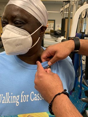 A Vietnam veteran receives her lapel pin.