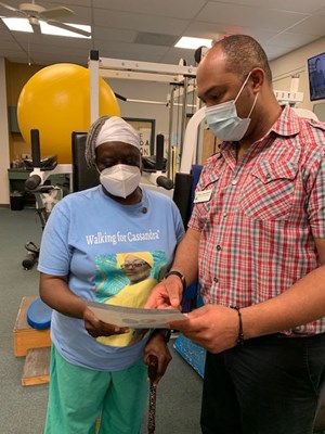 A Vietnam veteran receives her lapel pin.
