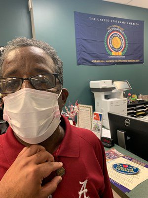 A Vietnam veteran receives his lapel pin.