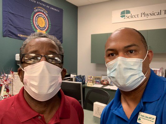 A Vietnam veteran receives his lapel pin.