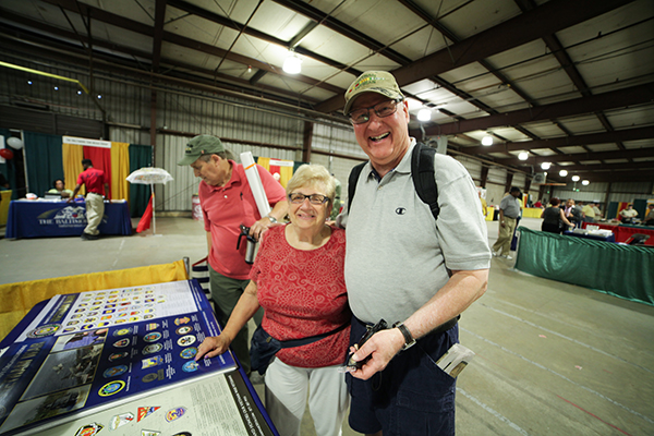 A Vietnam Veteran poses for a photograph with his wife.