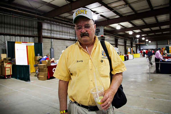 A Vietnam veteran pauses at the Vietnam War Commemoration display booth.