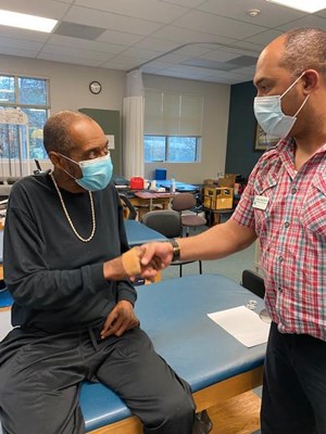A Vietnam veteran receives his lapel pin.