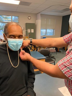 A Vietnam veteran receives his lapel pin.